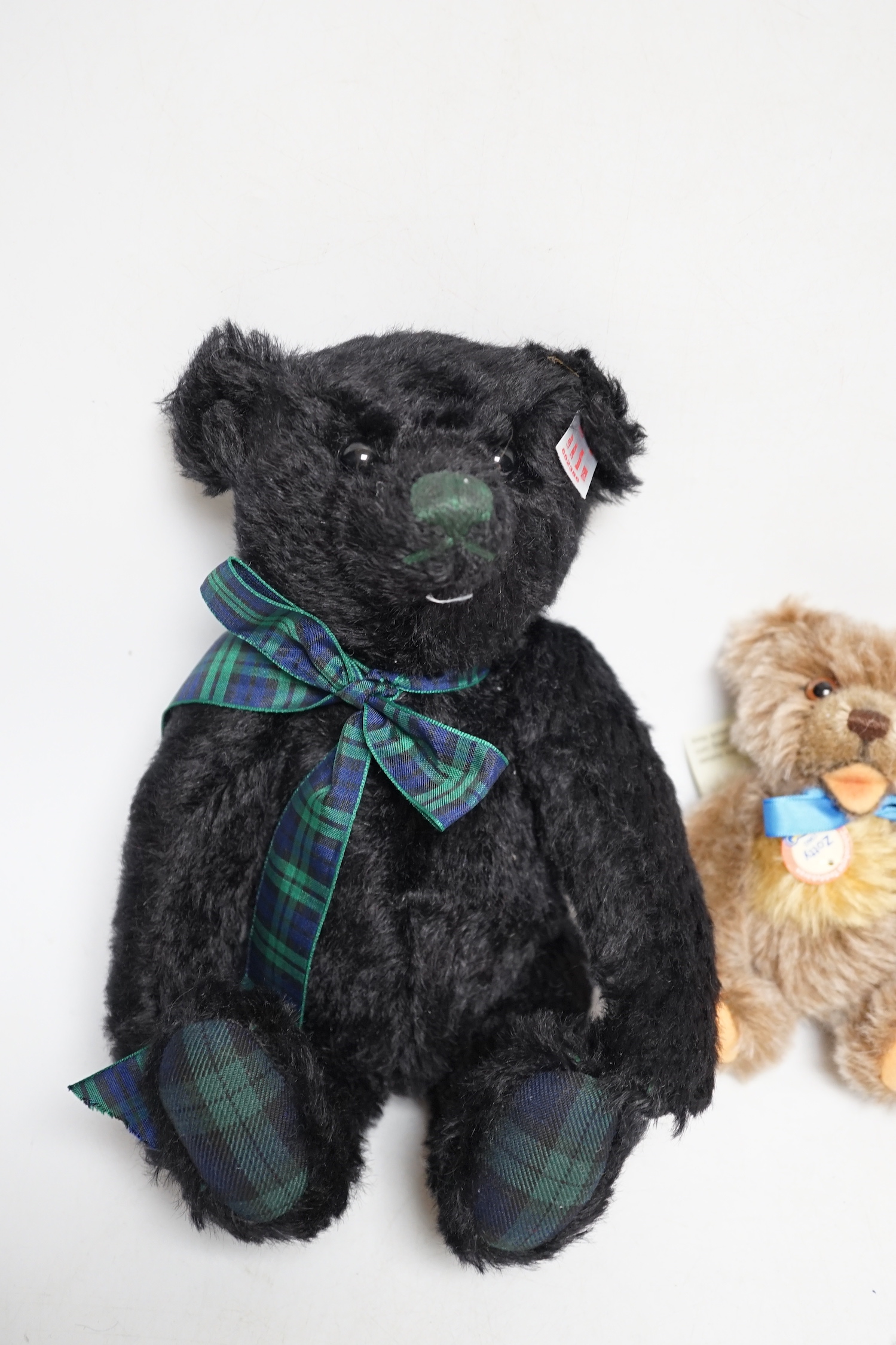 A Steiff musical Black Watch bear with bag and certificate with small Steiff Zotty yellow tag with bag